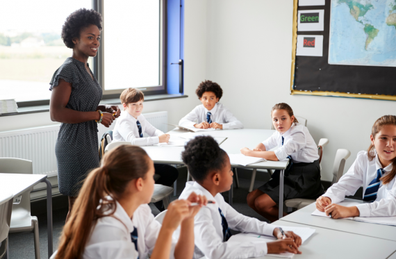 teacher working with secondary aged pupils