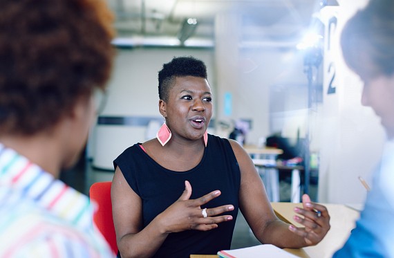 teacher discussing with others