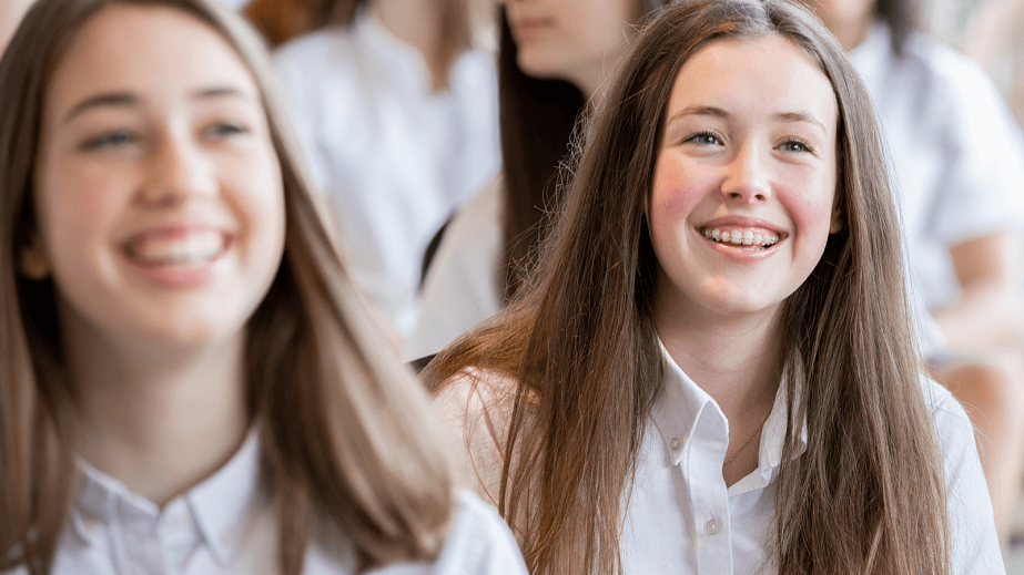 female pupils during a high school assembly