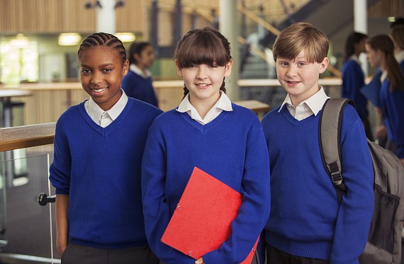 3 children in school uniform