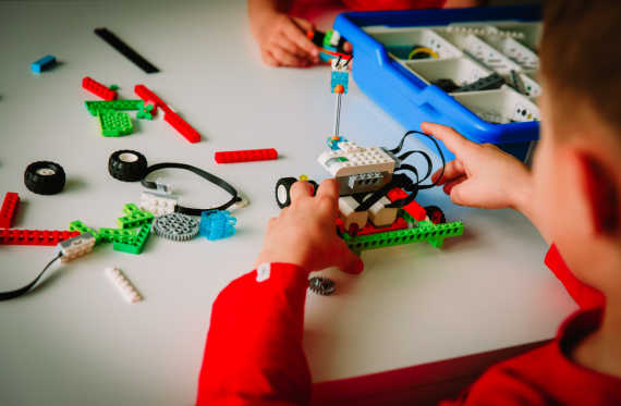 Child in school using lego to learn