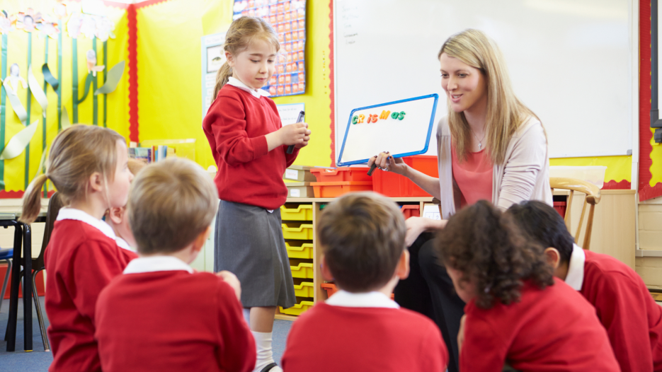 Primary Pupil Talking with Class