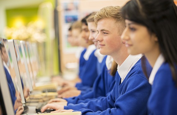 teacher working with secondary aged pupils