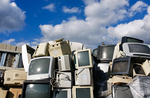 electronic waste piled up at landfill
